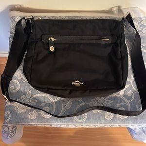Coach black nylon cross body bag w/ gold zippers and adjustable strap